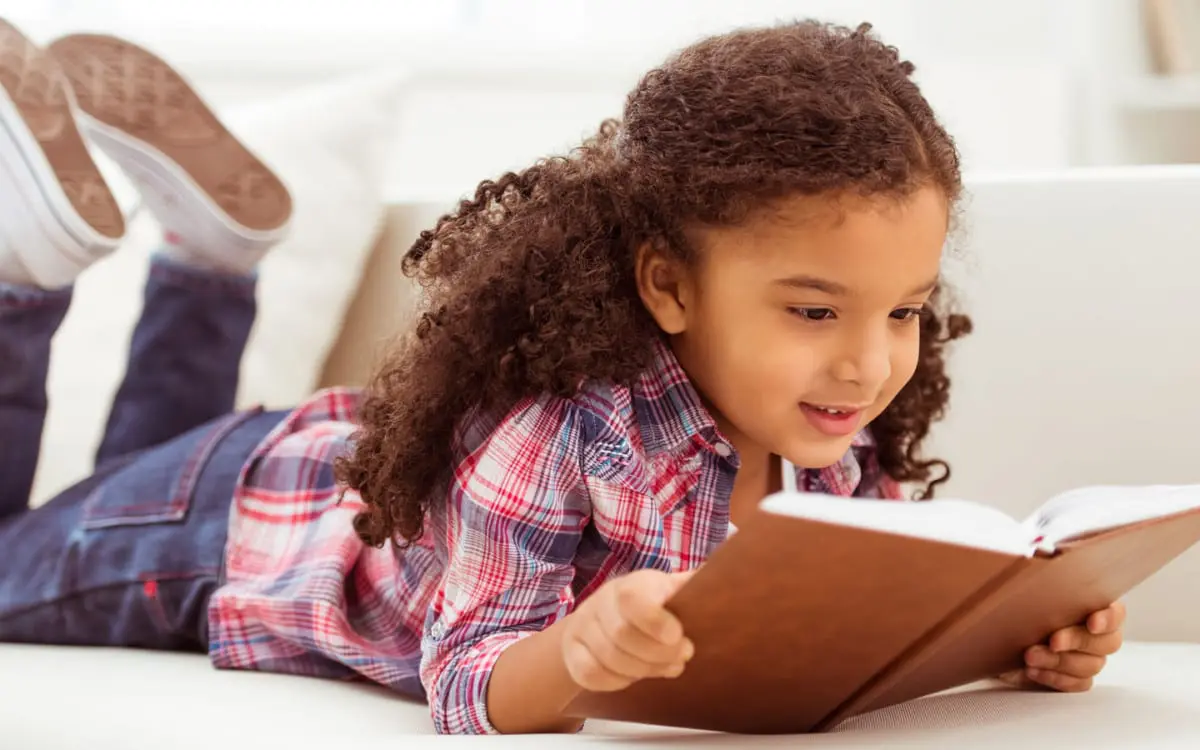This African-American child can celebrate Black History Month through reading