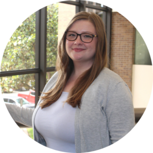 Professional headshot of a person wearing glasses