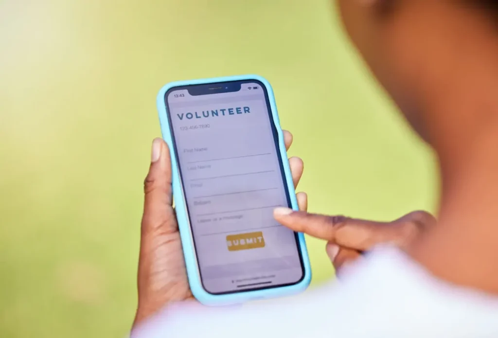 Parent Using Tablet and Easy Sign Up form to Volunteer 